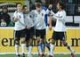 Klose (S-2) festeggia con i compagni (S-D) Mesut Oezil, Thomas Mueller e Sami Khedira dopo aver  segnato il gol durante l'amichevole Germania-Italia a Dortmund, il 9 febbraio 2011, finita 1-1