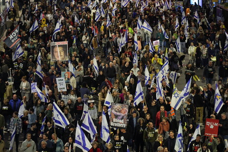 Families of hostages held in Gaza and their supporters attend a protest calling