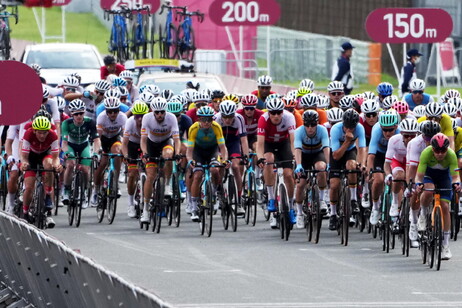 Riders enter the race track during the Road Cycling events of the Tokyo 2020 Olympic Games