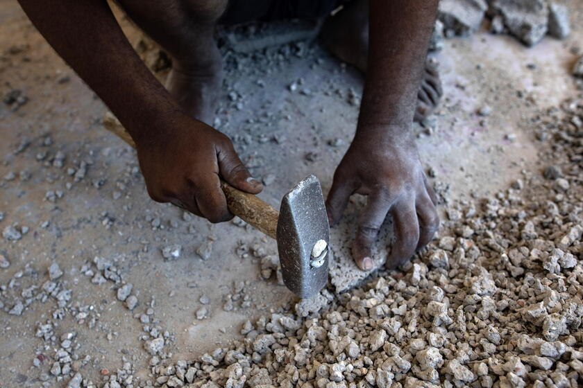 Palestinians make graves from the rubble of Gaza's destroyed homes