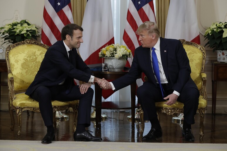 Donald Trump e Emmanuel Macron durante encontro em 2019 © ANSA/AP